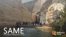 people walking in a natural canion